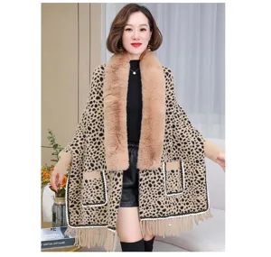 Leopard print knit poncho for women with large faux fur collar and fringe hem detail