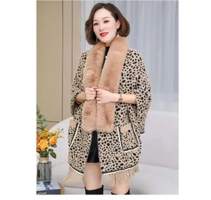 Women's leopard print knit poncho with soft faux fur collar and tassel hem detail