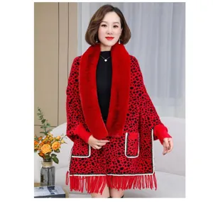Elegant red leopard print knitted poncho with luxurious faux fur collar and tassel hem