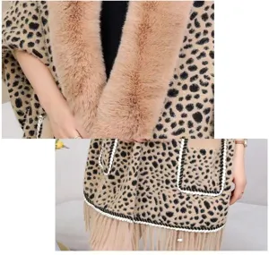 Close-up of leopard print knitted shawl featuring soft faux fur collar and fringed hem