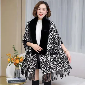 Elegant faux mink knit cape with large black fur collar and tassel fringe details