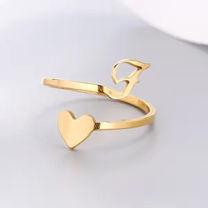 Detailed close-up of a gold stainless steel open ring with heart and letter design