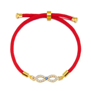 Detail view of Evil Eye infinity charm bracelet with adjustable red braided cord strap