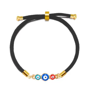 Adjustable black cord bracelet featuring three colorful Evil Eye charms and gold metal
