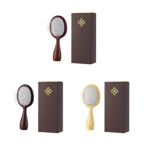 Ensemble de brosse à cheveux en bois avec coussin d'air et épingles en métal pour soins quotidiens.