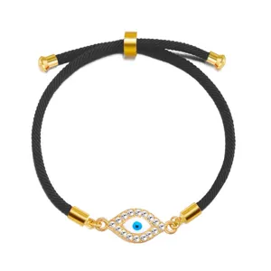 Close-up detail of an adjustable evil eye bracelet with rhinestones and gold accents