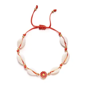 Bohemian cowrie shell bracelet with red cord and daisy charm for beach vacation
