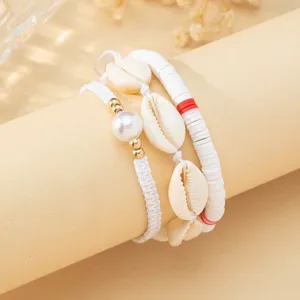 Detailed view of Bohemian white shell and pearl beaded bracelet set for beach vacation