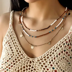 Bohemian 3-piece layered beaded necklace set with small gold disc pendants for women