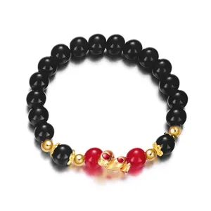 Close-up detail view of zodiac snake year bracelet with black and red stone beads