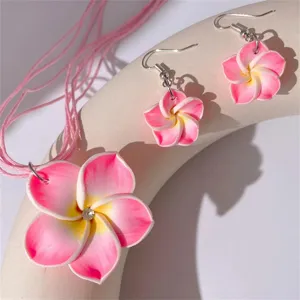 Schmuckset mit rosa und weißen Frangipani-Blüten, Halskette und Ohrringe