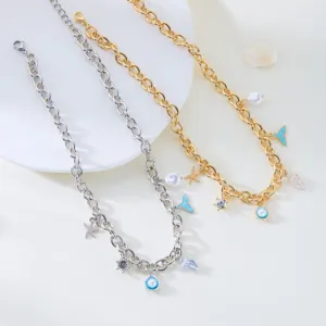 Detailed view of gold and silver ocean theme necklaces with shell and starfish charms