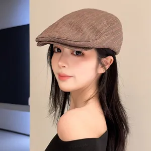 Stylish brown textured flat cap for women, retro newsboy hat, casual street fashion accessory.