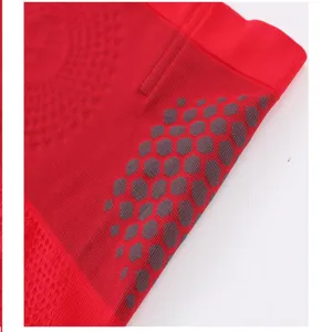Red seamless shapewear knit detail fabric breathable elastic texture close up view now.