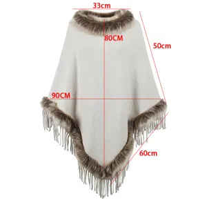 Detailed dimension diagram of white knitted poncho with faux fur trim and long fringe