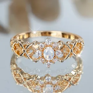 Elegant vintage gold hollow filigree ring with oval moonstone and zircon cluster accent