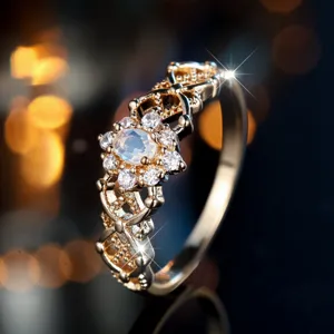 Elegant gold-plated filigree ring featuring oval moonstone halo setting with sparkling stones