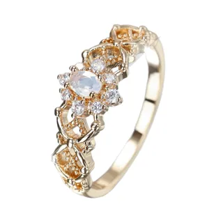 Elegant gold-plated filigree ring featuring an oval moonstone surrounded by cubic zirconia