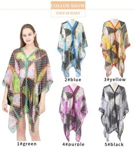 Multi-color printed faux silk shawl with pearl button detail in five vibrant shades.
