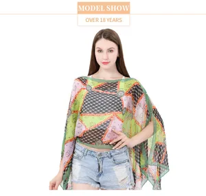Detailed view of a lightweight printed imitation silk shawl featuring pearl button details