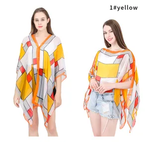 Summer checkered sun protection shawl shown on two models with vibrant yellow patterns