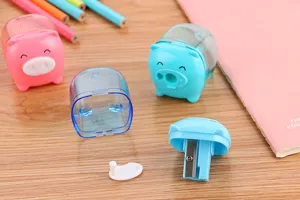 Close-up of cute pig-shaped pencil sharpener showing internal blade detail