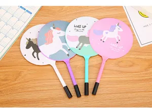 Creative cartoon unicorn fan ballpoint pens in four pastel colors on a wooden background