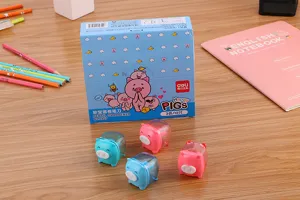 Close-up of cute pig-shaped pencil sharpeners in pink and blue colors