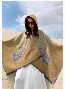 Stylish bohemian hooded cashmere-like shawl poncho for women in a sunny desert setting