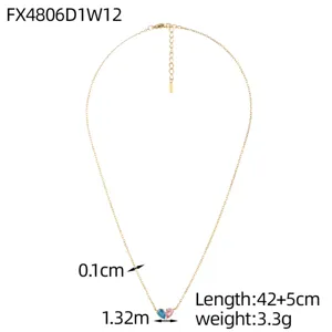 Detail view of gold heart necklace with blue and pink stones showing dimensions