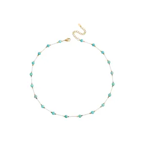 Elegant Bohemian beaded necklace with turquoise-style gems and gold-plated chain detail.