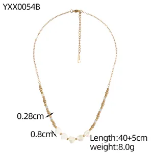 Close-up detail of a gold beaded necklace featuring heart shell charms and size specifications