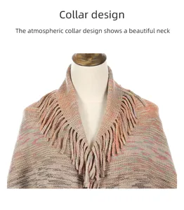 Detailed view of a knitted winter poncho collar with elegant tassel and fringe trim.