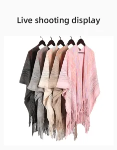 Selection of knitted poncho capes with fringe detail in multiple colors