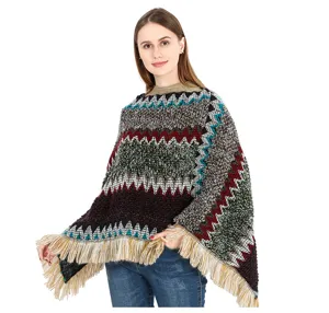 Detail view of ethnic zigzag knitted poncho with decorative fringe hem