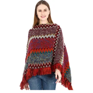 Detailed view of women's colorful ethnic style knitted poncho with fringe tassels