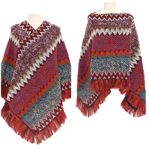 Detailed view of a colorful ethnic knit poncho with bohemian chevron patterns and fringe.