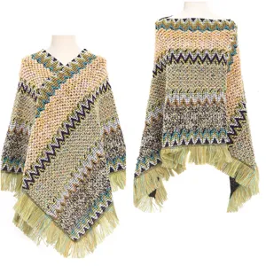 Front and side view of a colorful ethnic knit poncho with decorative tassel fringe on mannequins