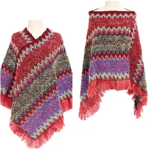 Detail view of ethnic knit poncho featuring colorful zigzag patterns and long fringes.
