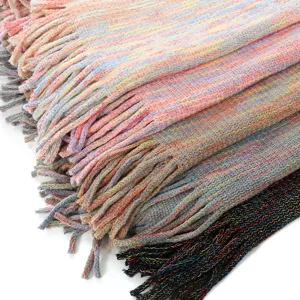 Detailed view of warp knitted colorful winter shawls with soft fringes and decorative tassels