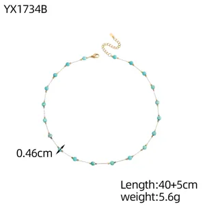 Detailed view of Bohemian necklace with turquoise beads and gold spacer beads