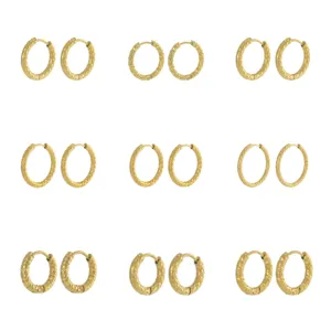 Detailed view of gold plated titanium steel hoop earrings featuring a hammered texture