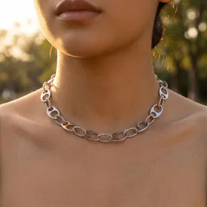 Silver vintage chunky chain necklace with hollow oval links on model in golden hour sunlight