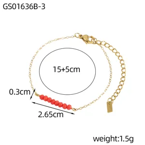 Close-up of minimalist gold chain bracelet with red natural stones and precise measurements.