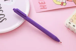 Close-up of a purple Morandi retractable gel pen with matte finish on pink background