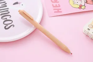 Detail view of a Morandi color retractable gel pen with a matte apricot finish.