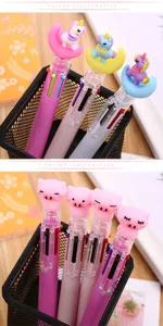 Detail of cute unicorn and pig cartoon toppers on multi-color ballpoint pens