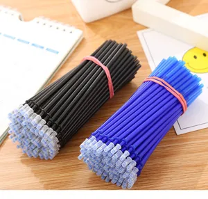 Close-up of black and blue erasable pen refills bundled with rubber bands