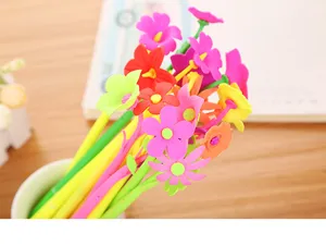 Close-up of vibrant colorful flower-shaped tops on cute stationery gel pens
