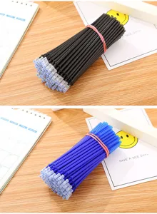 Bundles of black and blue erasable gel pen refills on a wooden desk with stationery.